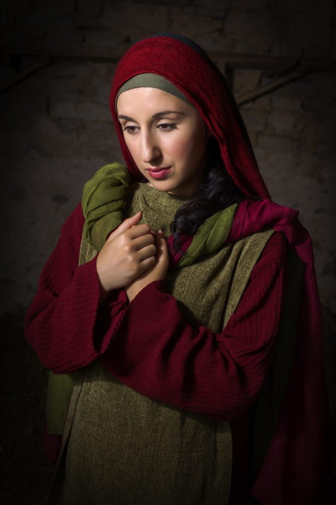 Portrait of a model in biblical clothing during a bible scene acting as Mary Magdalene 