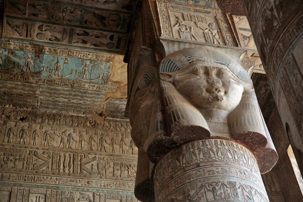DENDERA TEMPLE, QENA, EGYPT - DECEMBER 05, 2014: Pillars decorated with face of the Egyptian goddess Hathor in Dendera temple