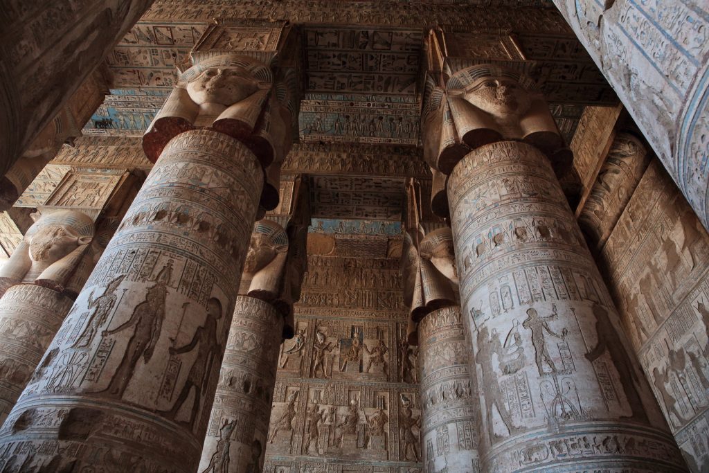 DENDERA TEMPLE, QENA, EGYPT - DECEMBER 05, 2014: Pillars decorated with face of the Egyptian goddess Hathor in Dendera temple