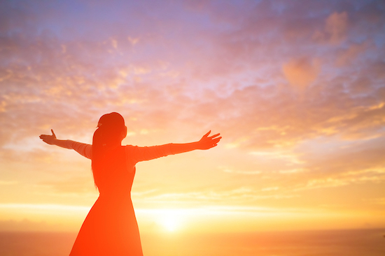 Young woman outstretched arms