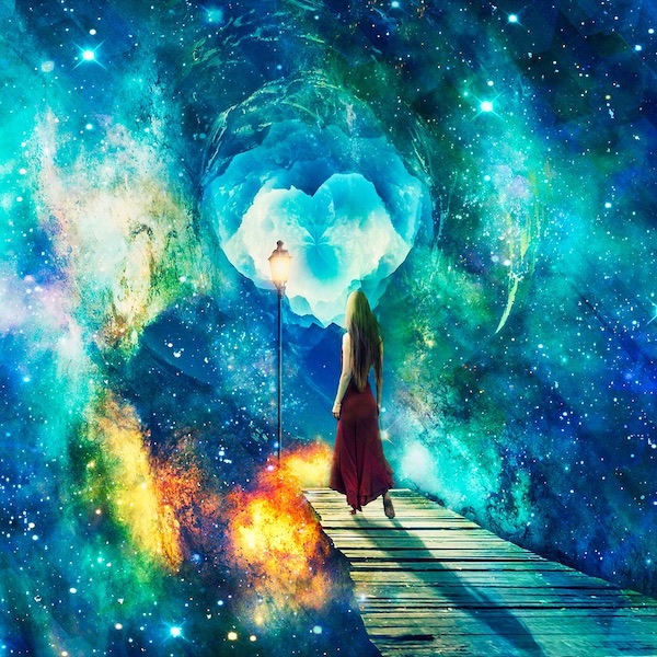 Woman standing in front of colourful universe